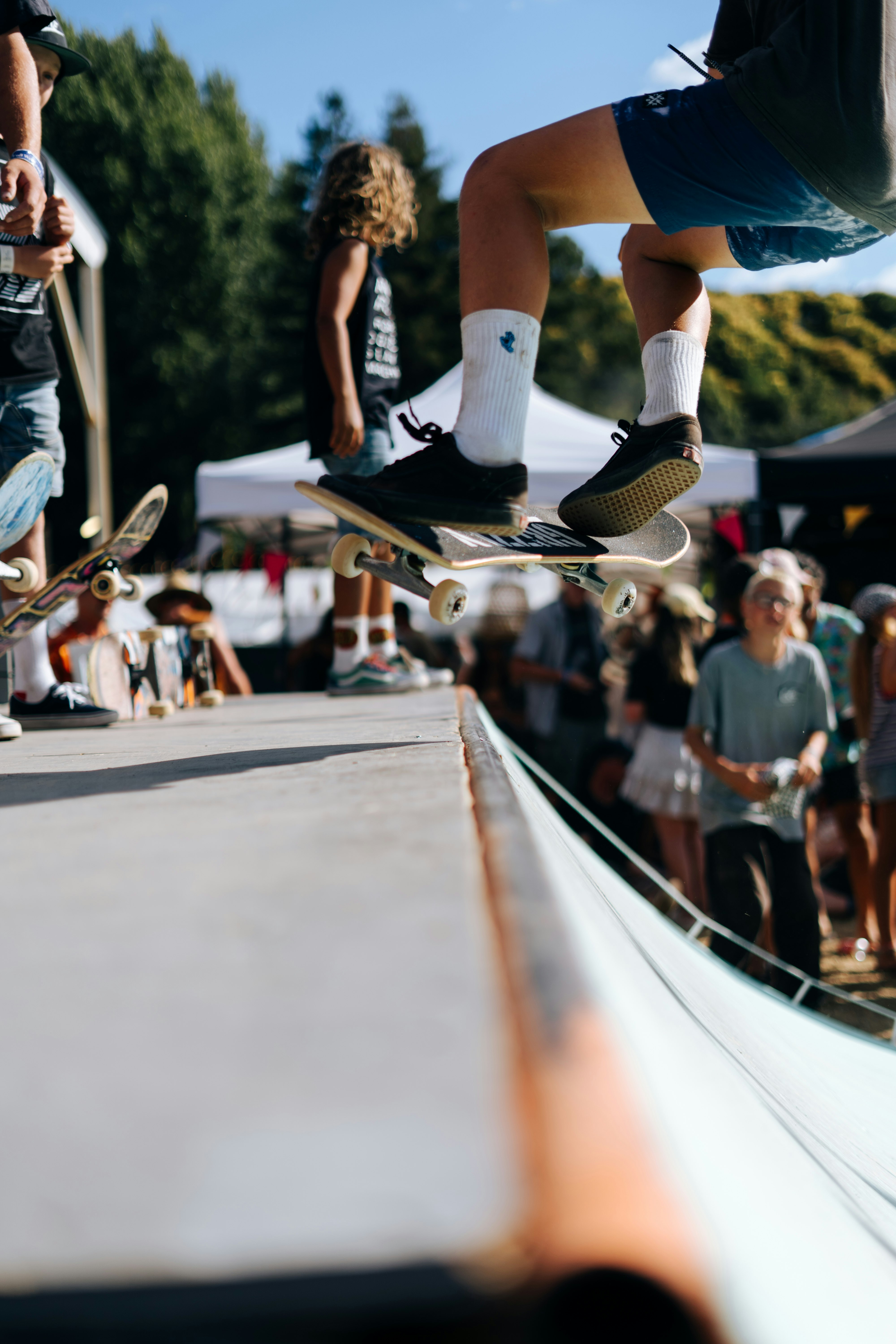 people riding skateboard during daytime